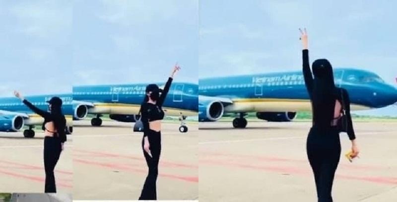 Nữ hành khách thả dáng quay TikTok sát máy bay tại khu vực sân đỗ sân bay Phú Quốc. Ảnh căt từ clip  - 0e6d2234-15d8-4cea-bed2-fd4a8303730f-7674 - Cấm Bay Nữ Hành Khách Thả Dáng Quay TikTok Giữa Sân Đỗ Sân Bay Phú Quốc
